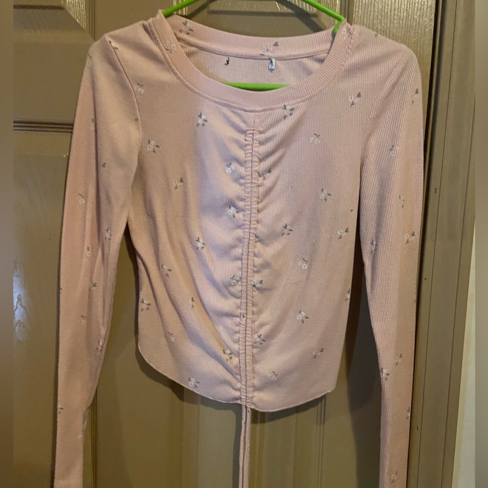 Pink shirt with flowers on it good for warm weather.